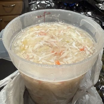 Vietnamese crab asparagus soup in a catering tray