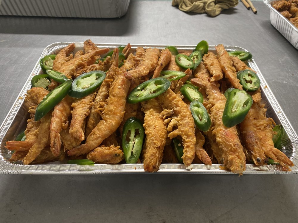 Fried salt and pepper prawns topped with sliced jalapeños
