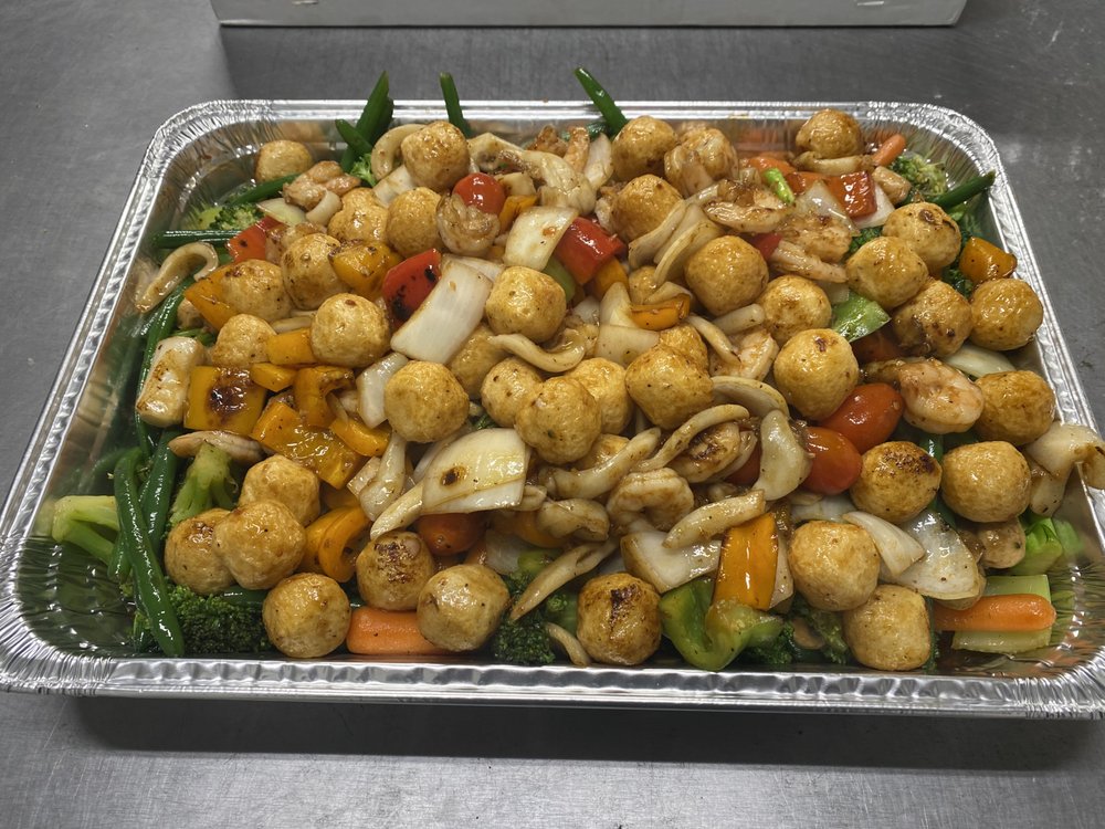 Fish balls, shrimp and squid stir-fried with broccoli, green beans and peppers